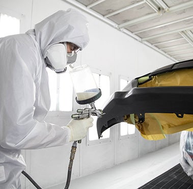 Collision Center Technician Painting a Vehicle | Thousand Oaks Toyota in Thousand Oaks CA